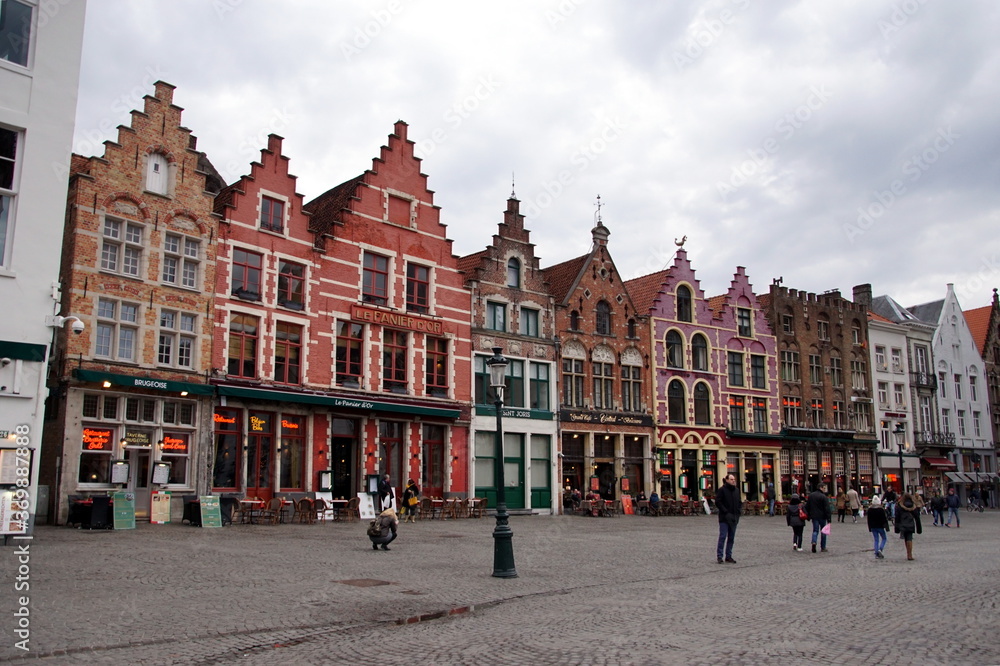 View of the colorful houses in traditional Flemish style on Grote Markt or Market Square in Bruges, Belgium