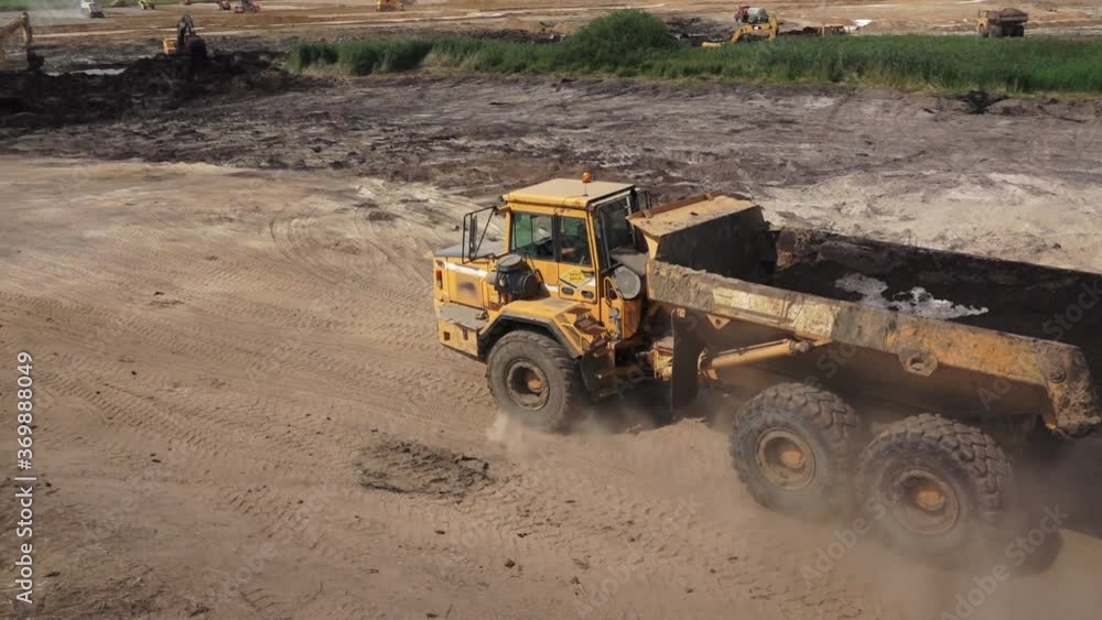 Heavy Vehicles Driving on a Dusty Road Heavy Vehicles Driving on a Dusty Road