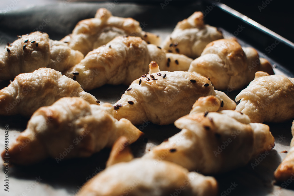 Freshly baked homemade croissants on wooden table, selective focus Fresh out of the oven. Breakfast or brunch concept. Freshly baked homemade croissants on wooden table, selective focus Fresh out of the oven. Breakfast or brunch concept.