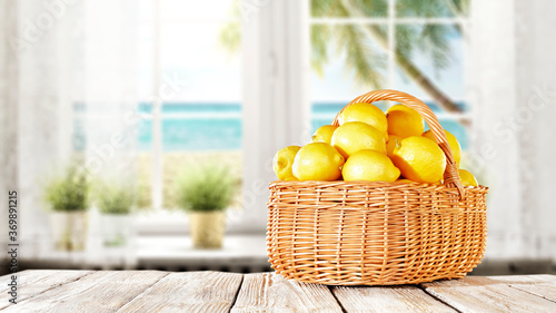 Fresh lemon fruits on wooden table and free space for your decoration 