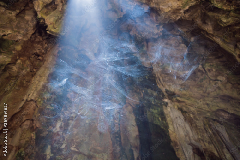 Smoke in a buddhist temple. Huyen Khong Cave with shrines, Marble mountains, Vietnam