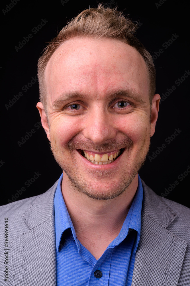 Portrait of happy handsome businessman in suit with blond hair Portrait of happy handsome businessman in suit with blond hair