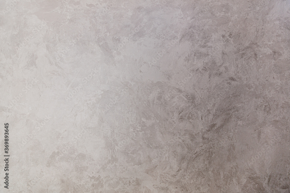 Naklejka premium Texture of gray decorative plaster with the effect of wet silk. Hand made. Abstract background.