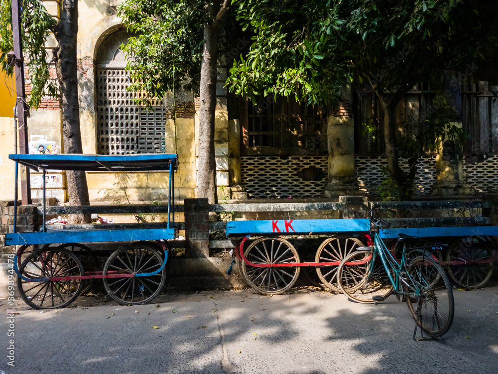 Parked wooden wheeled carts in a street in Pondicherry