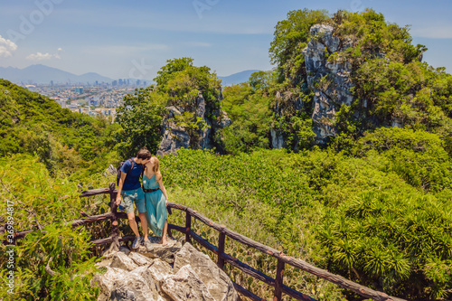 Couple of tourists on the background of Beautiful Marble mountains and Da Nang, Vietnam