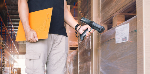 Photography Workers Scanning Bar Code Scanner on Label of Package Boxes