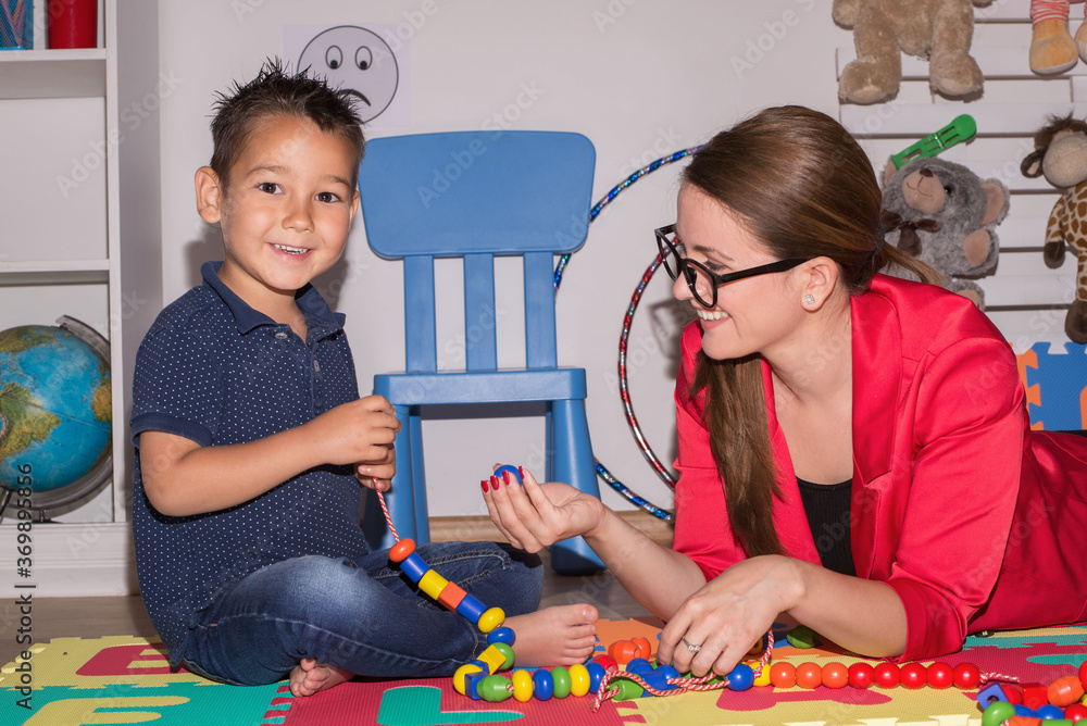 Shot of a speech therapist during a session with a little boy Shot of a speech therapist during a session with a little boy