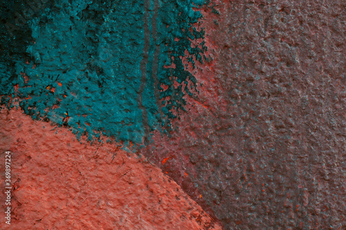 The wall texture was painted with terracotta, deep orange and dark green paint with splashes. There is space for text. The photo was shot for your grunge design.