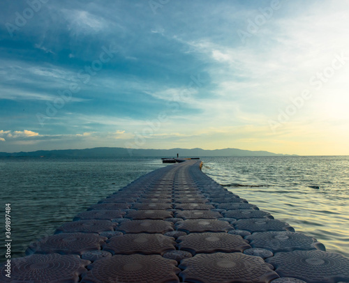 Yoga at dusk on a Pier in Haad Rin, Koh pha Ngan, Thailand photo