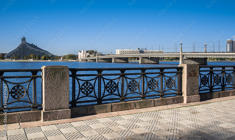 Fototapeta premium The Stone Bridge (Akmens tilts) and the Railway Bridge (Dxelzcela tilts) across Daugava river, Riga, Latvia.