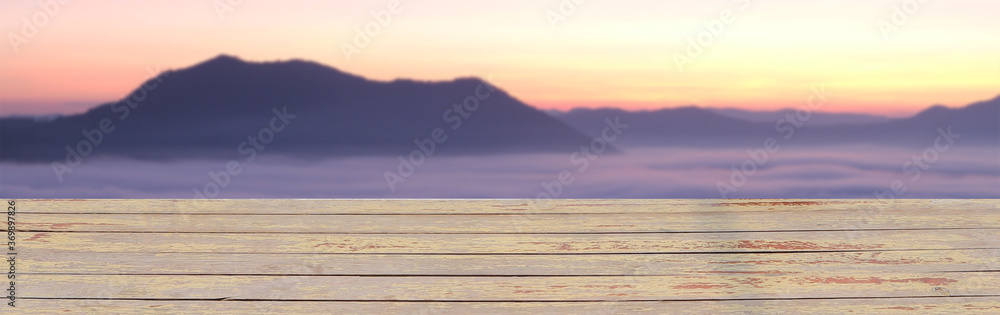shelf floor with light mist in morning sunrise on the mountain for the background. shelf floor with light mist in morning sunrise on the mountain for the background.