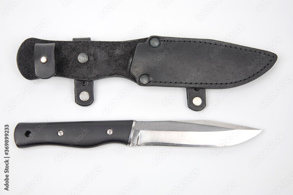 knife for camping and hunting in a leather case on a white background. cutting tool. isolated object knife for camping and hunting in a leather case on a white background. cutting tool. isolated object