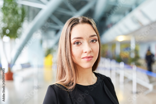 Young woman as a passenger in the airport terminal
