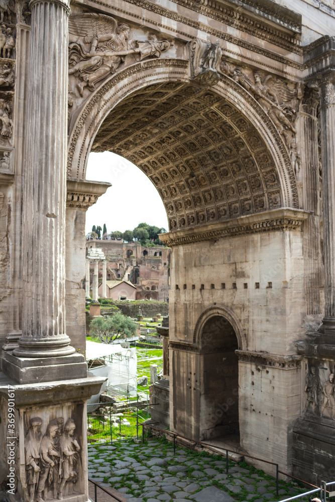 Fragment of the triumphal Arch of Septimius Severus in The Roman forum. Italy.
