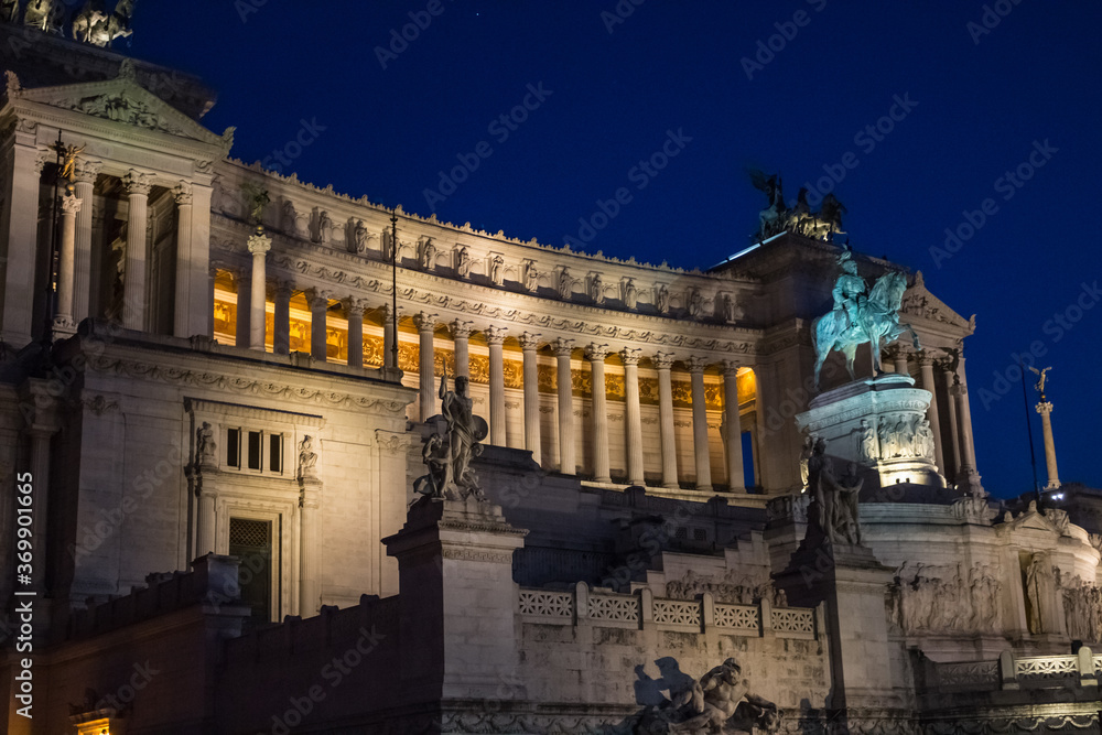 Monument in honor of the first king of the United Italy - Vittoriano. It is located on the Square of Venice on the slope of the Capitoline hill. Evening shooting on a dark blue background.