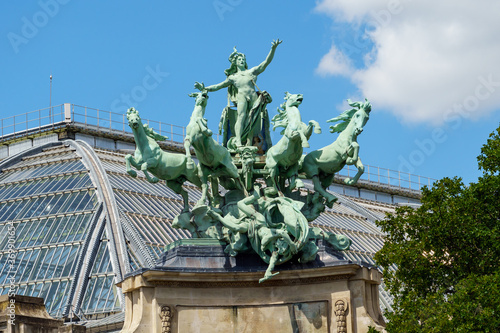 Close-up view of bronze quadriga statue Harmony Triumphing over Discord on top of the Grand Palais in Paris (by Georges Recipon 1860 - 1920) - Paris, France