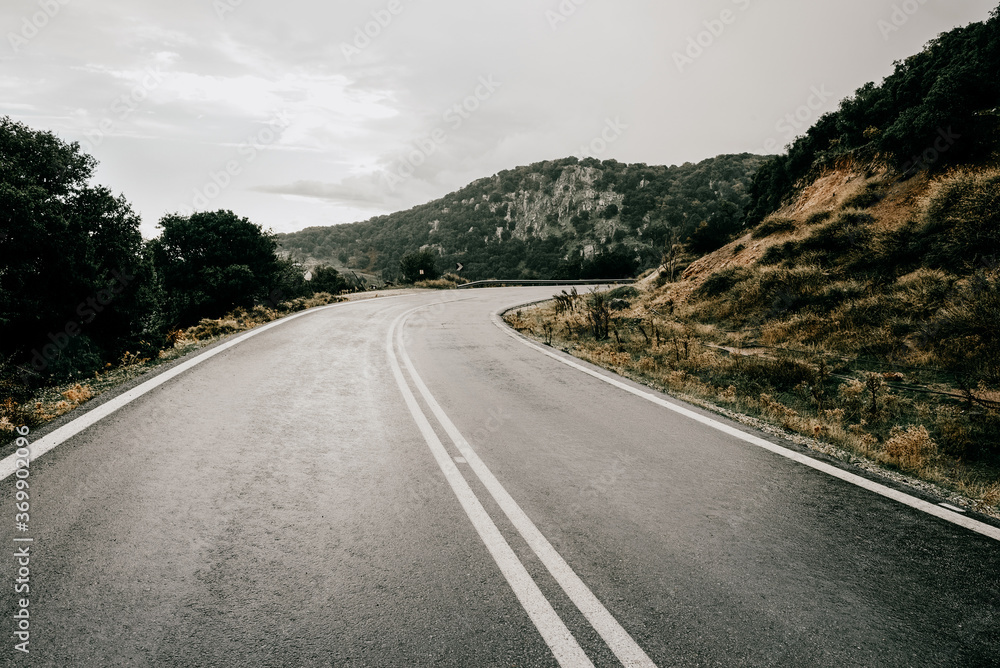 Cinematic road landscape. Lesbos Island, Greece. Misty road