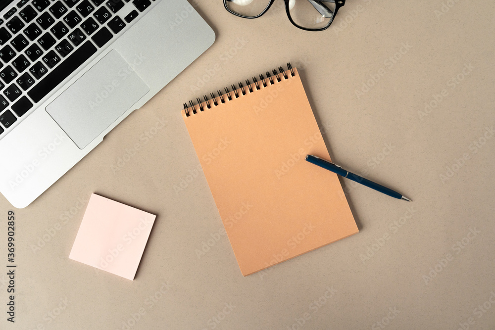 Open laptop with blank notebook, view from above. Workplace concept Open laptop with blank notebook, view from above. Workplace concept