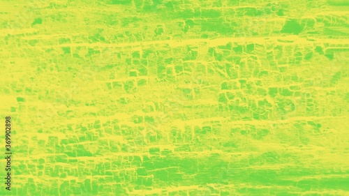 Vivid green yellow patchy background, wooden texture. Panorama