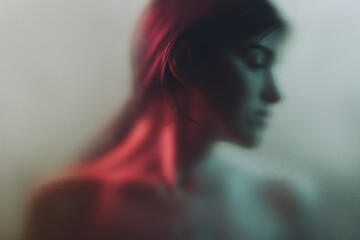 Art portrait. Feminine mystery. Sensual woman blur silhouette in neon red light gray fog with noise effect. Soul freedom. Loneliness contemplation. Subconscious melancholy.