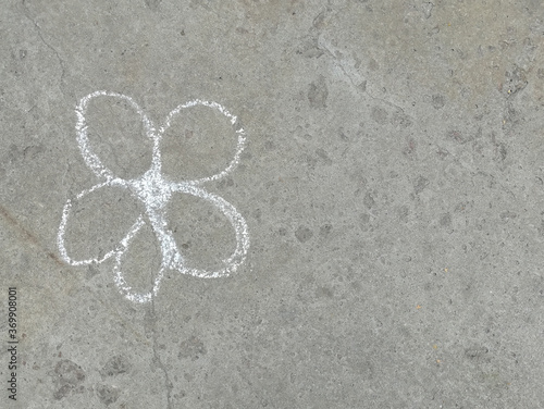 flower is drawn with chalk on the asphalt. summer. banner place for text, children, creativity, copy space