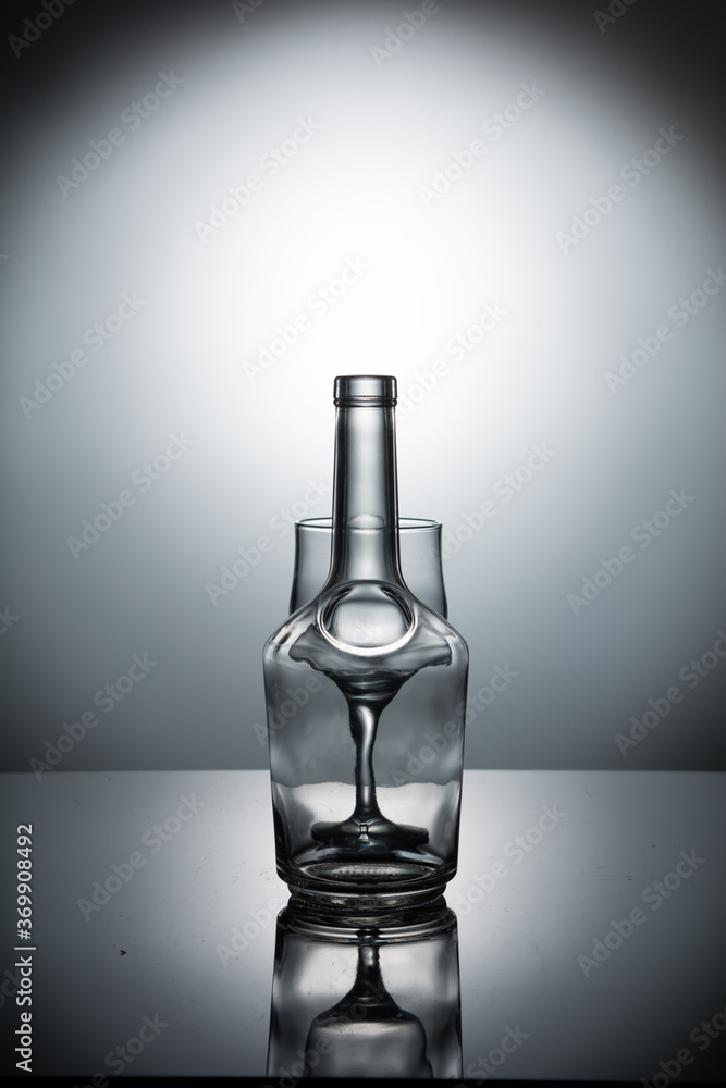 Semi-optical illusion with a bottle and wineglass Semi-optical illusion with a bottle and wineglass
