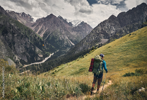 Hiker with big backpack in the mountains