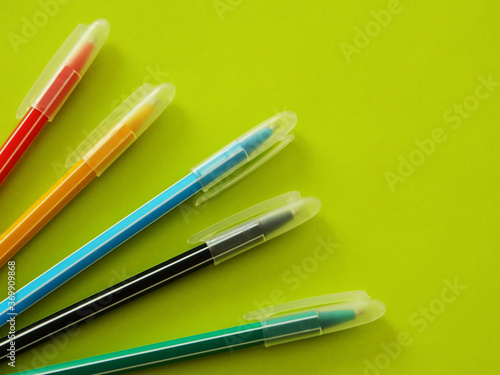 pens on a green background
