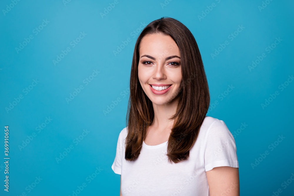 Fototapeta premium Closeup photo of attractive pretty adorable lady good mood smiling teeth beaming charming cute straight hairstyle wear casual white t-shirt isolated blue color background