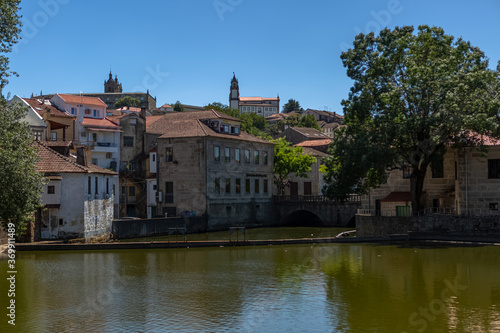 View at the Viseu city downtown, with the Paiva river , classic buildings and Cathedral of Viseu and Church of Mercy on top
