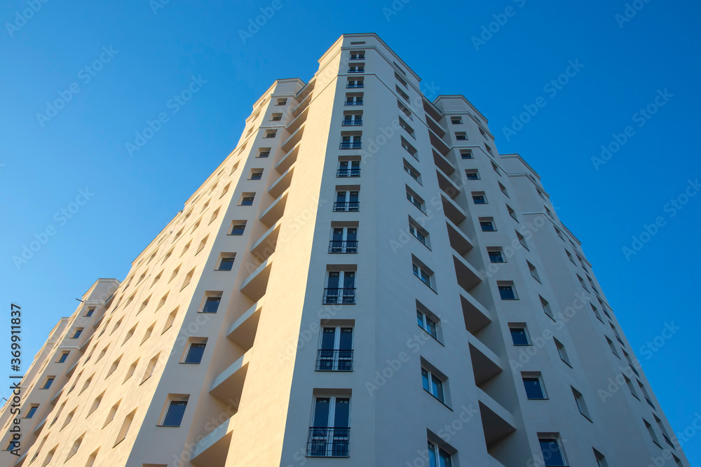 Facade of a new multi-story residential building. architecture and modern construction Facade of a new multi-story residential building. architecture and modern construction