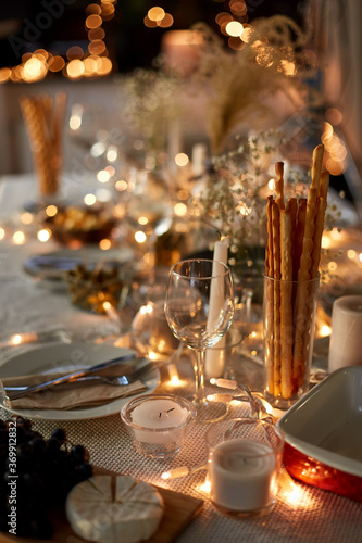 eating, holiday and celebration concept - dinner party table serving at home
