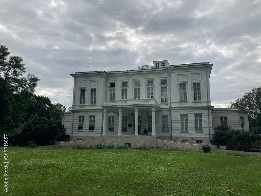Picturesque place of white. Palace with pond and green trees. Picturesque place of white. Palace with pond and green trees.