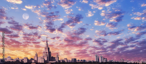 Aerial view of dramatic cloudy sky over main building of old university in sunset Moscow