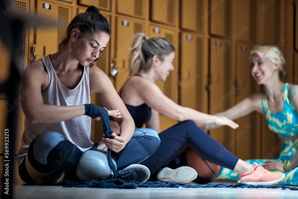 Young girl preparing for a boxing training Young girl preparing for a boxing training