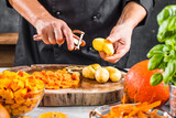  mid section of chef cleaning potatoes for pumpkin soup 