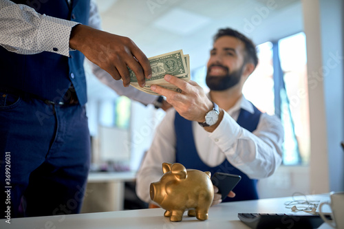 Employee getting bonus payed in cash photo