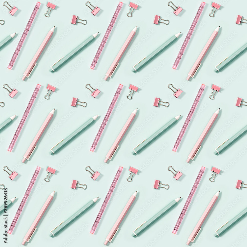 Creative seamless pattern with office supplies, color pencils, pens, puler and metal paper clips. School and education concept. Creative seamless pattern with office supplies, color pencils, pens, puler and metal paper clips. School and education concept.