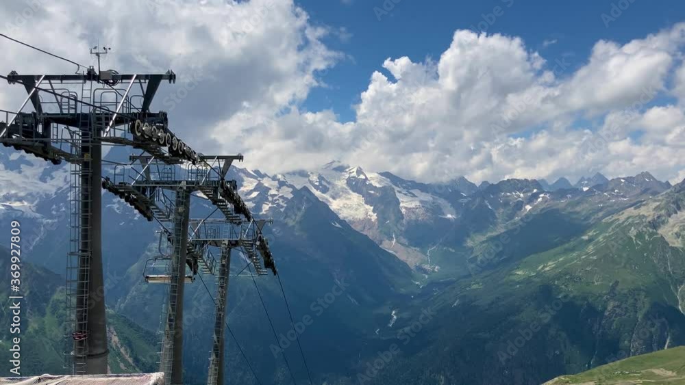 Modern ropeway with benches in amazing mountainous terrain. Modern ropeway with benches in amazing mountainous terrain.