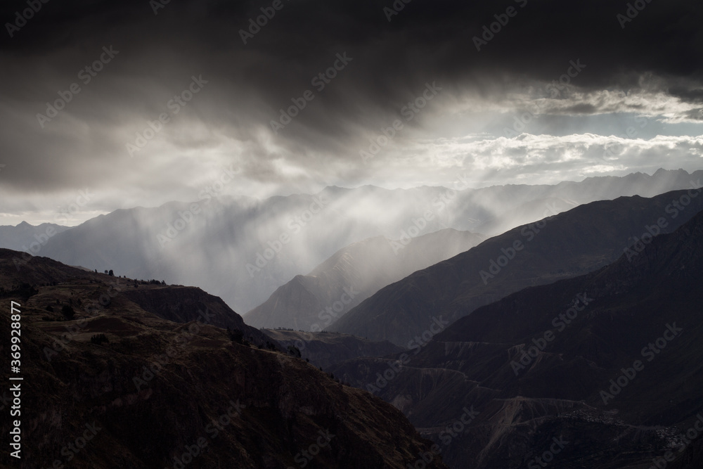 Mountainworld in Peru with stunning clouds and silhouette