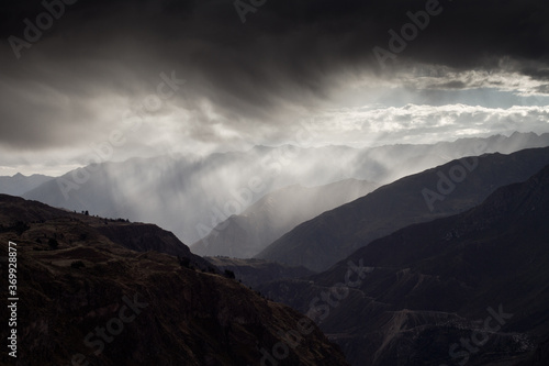 Mountainworld in Peru with stunning clouds and silhouette