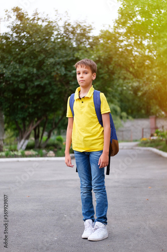 Boy with a backpack and notebooks