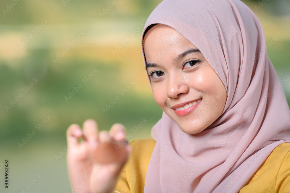 Asean woman applying makeup on her face Asean woman applying makeup on her face