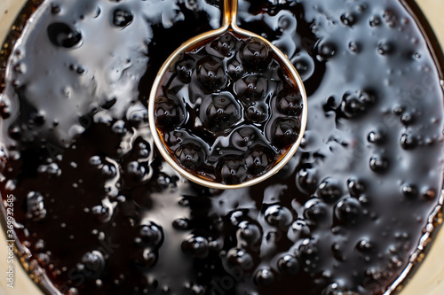 Photos Cooking, boiling brown sugar flavor tapioca pearl balls, ingredient of bubble tea, preparing food and drink, close up, recipe cookbook steps design concept