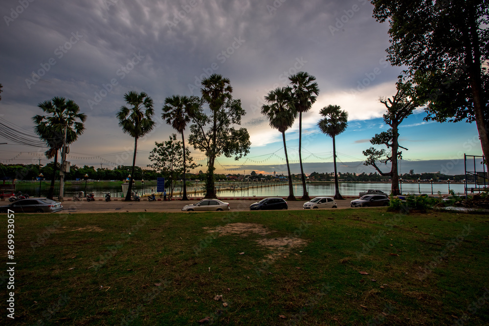 The blurry abstract background of the morning sky by the reservoir and there is a walkway to watch nature for exercise or rest while traveling The blurry abstract background of the morning sky by the reservoir and there is a walkway to watch nature for exercise or rest while traveling