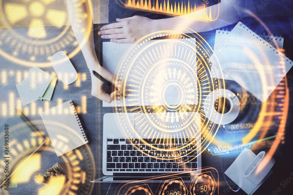 Fototapeta premium Tech theme hologram over woman's hands taking notes background. Concept of hightech. Double exposure