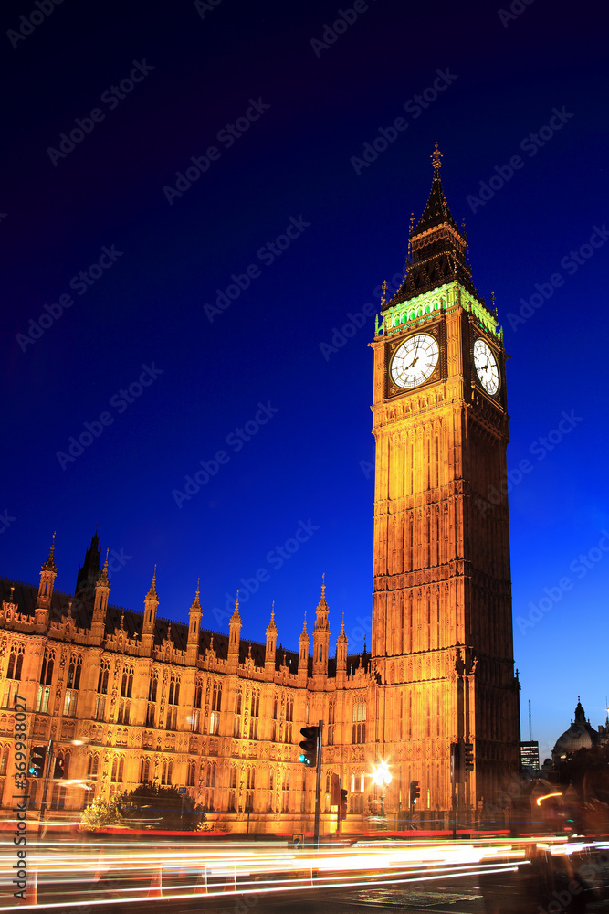 Big Ben of the Houses of Parliament London England UK at night with car light trails which is a popular tourism travel destination visitor landmark of the city stock photo