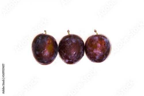  Three plums on isolated white background 