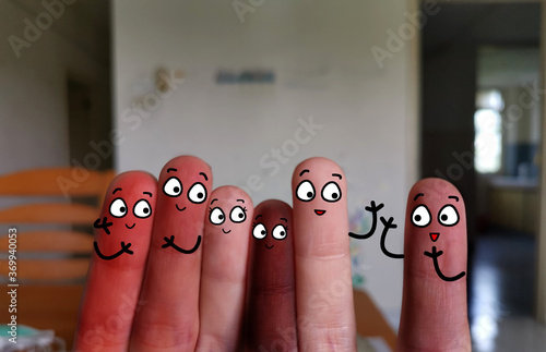 Six fingers are decorated as a group of friend and a new member. They are happy. They are from different countries. photo