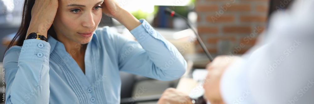 Sad business woman in office hold hands behind head. Time manager workflow concept Sad business woman in office hold hands behind head. Time manager workflow concept